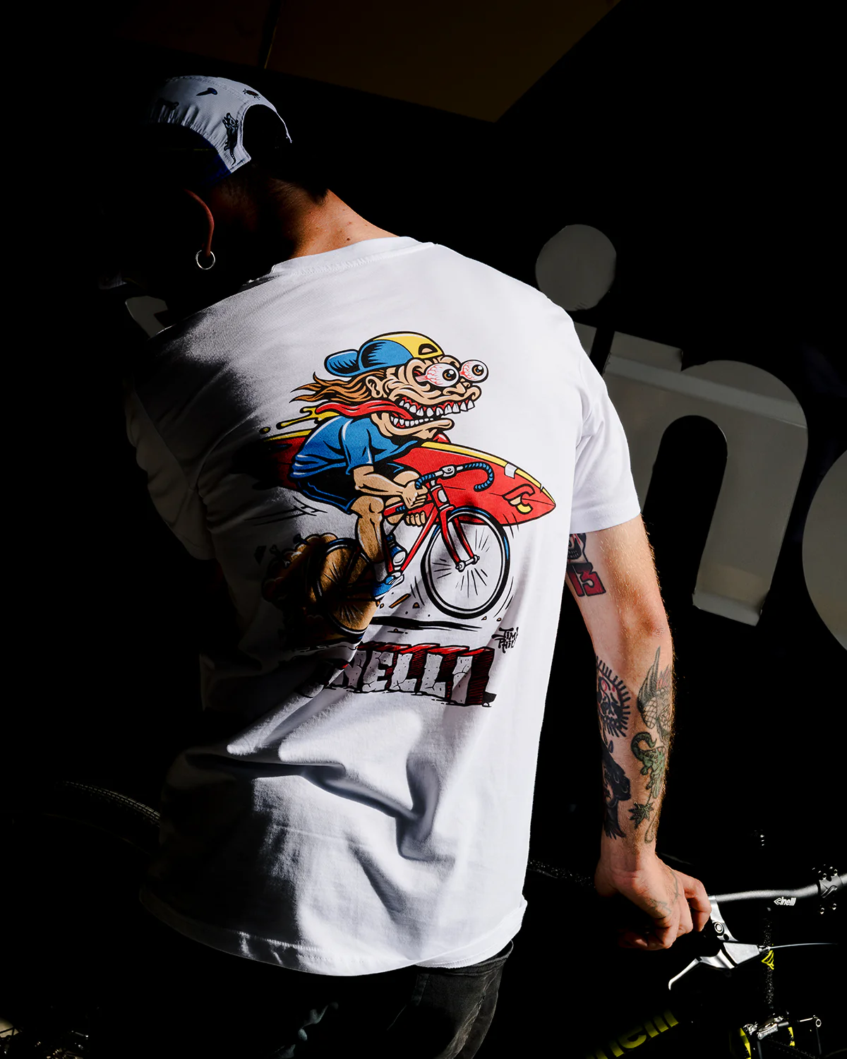 Rider wearing a Cinelli Jimbo Phillips graphic tee